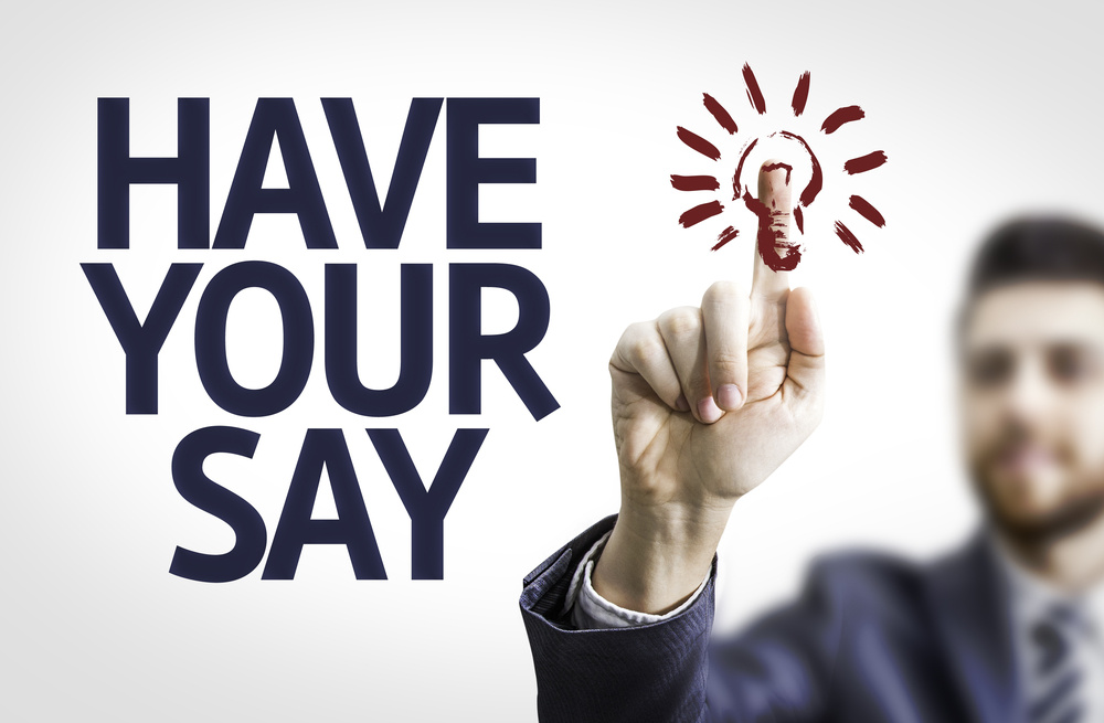 Business man pointing to transparent board with text Have Your Say Business man pointing to transparent board with text Have Your Say