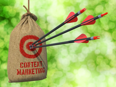 Content Marketing - Three Arrows Hit in Red Target on a Hanging Sack on Natural Bokeh Background.-2