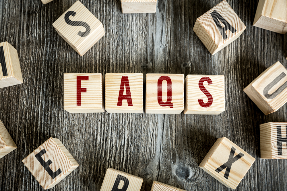 Wooden Blocks with the text Faqs