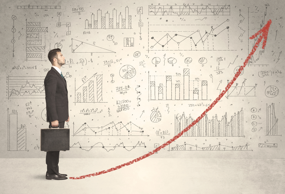 Business man climbing on red graph arrow concept on background
