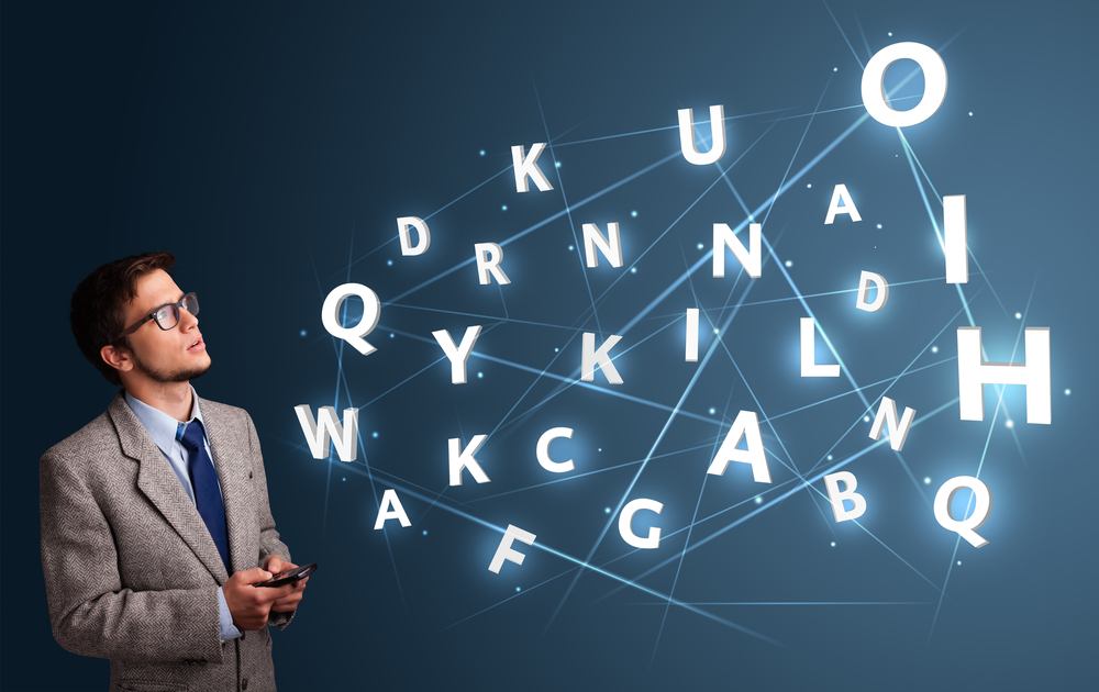 Handsome young man typing on smartphone with high tech 3d letters comming out